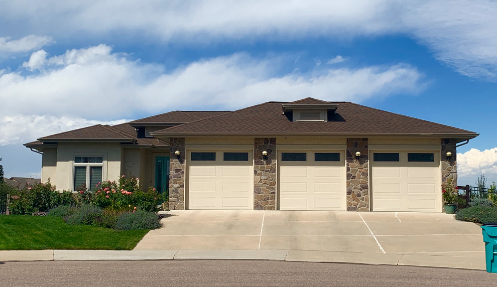 Medium sized and beige classic bungalow render detached house in Denver with a hip roof and a shingle roof.