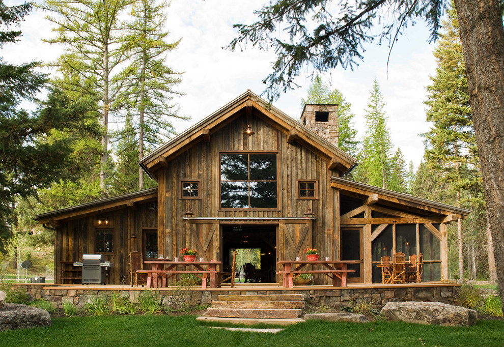 Example of a mid-sized mountain style wood exterior home design in Denver