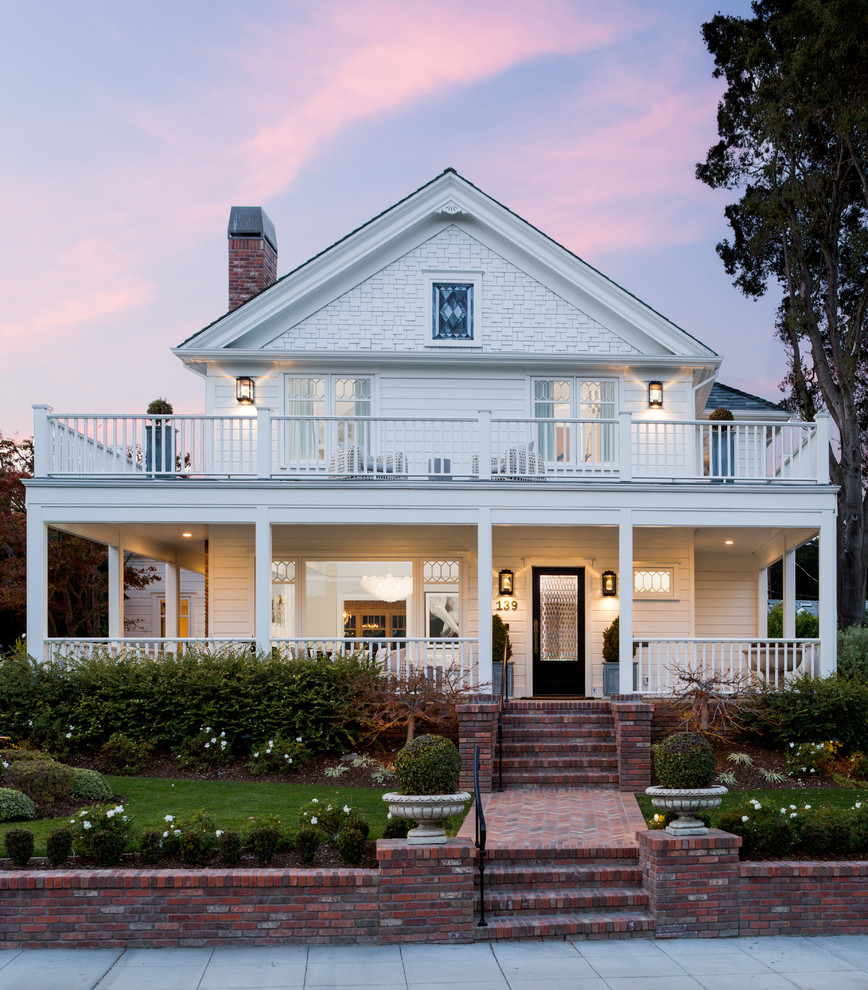 Large transitional white three-story wood exterior home idea in San Francisco with a shingle roof