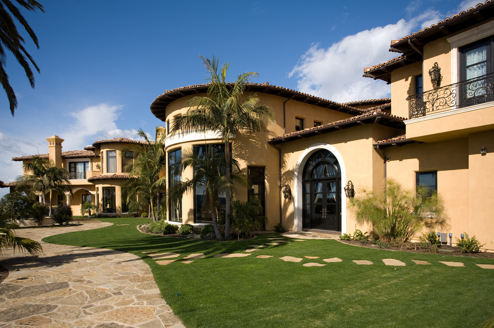 Example of a tuscan exterior home design in San Diego