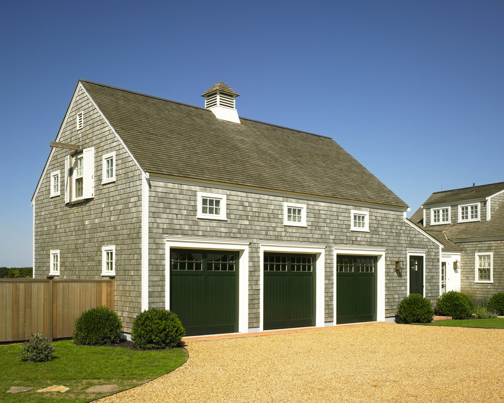 This is an example of a medium sized coastal two floor house exterior in Boston with wood cladding.