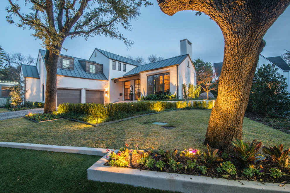Example of a large minimalist white two-story brick house exterior design in Dallas with a hip roof and a metal roof