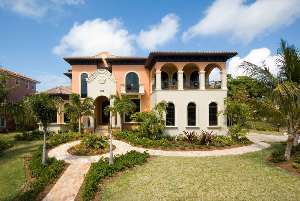 Example of a tuscan two-story exterior home design in Tampa