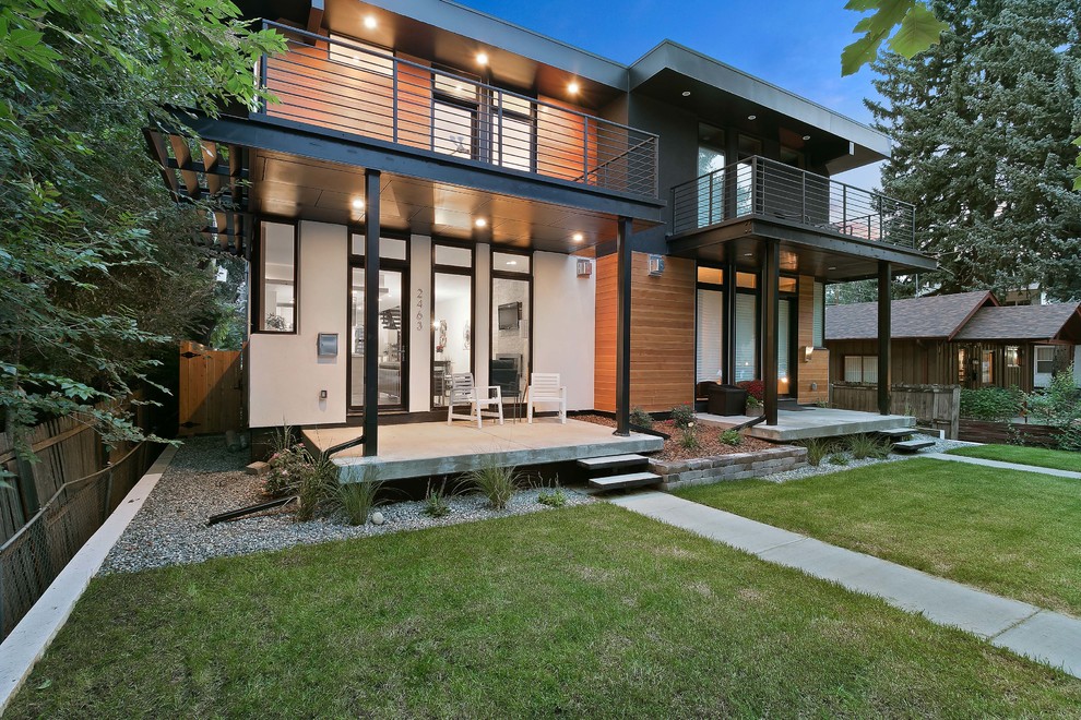 Inspiration for a medium sized and gey contemporary two floor house exterior in Denver with wood cladding.
