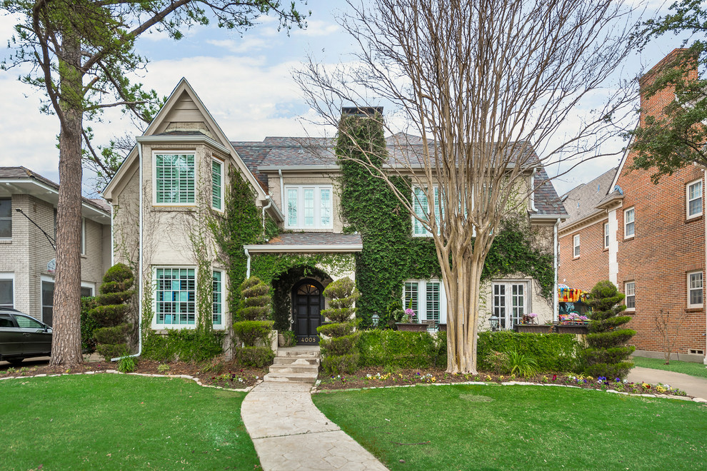 Inspiration for a large timeless gray two-story house exterior remodel in Dallas with a shingle roof