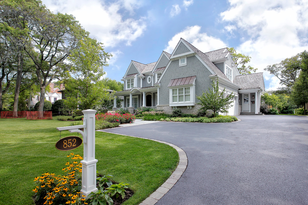 Classic two floor house exterior in Chicago with wood cladding.