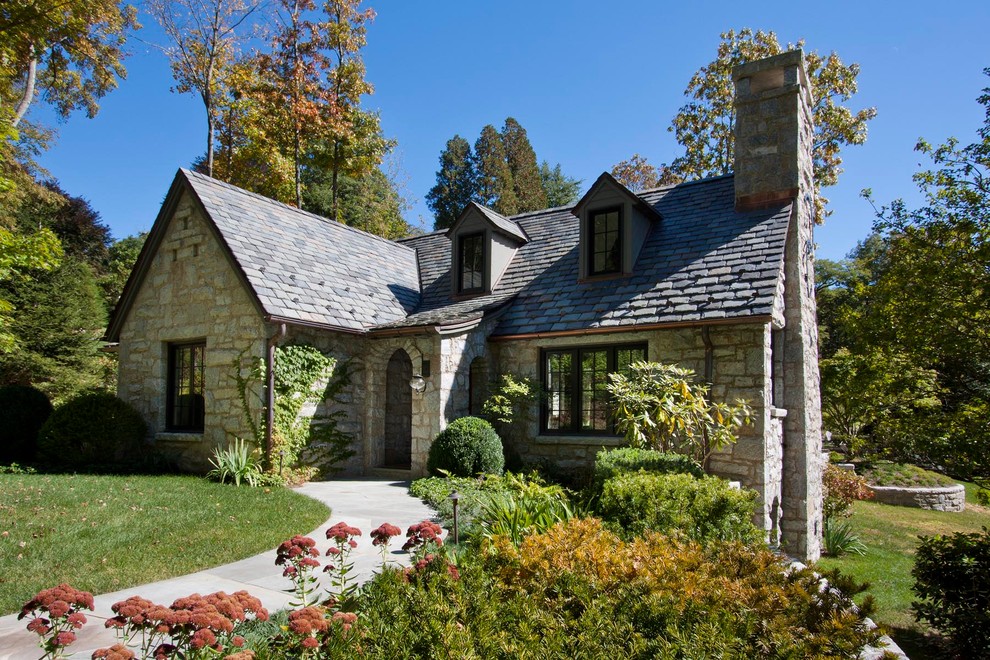 Inspiration for a rustic stone exterior home remodel in Other