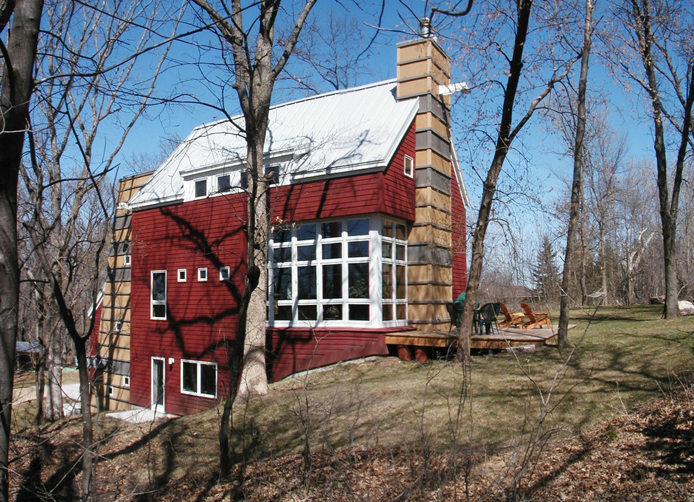 Diseño de fachada roja actual con revestimiento de aglomerado de cemento
