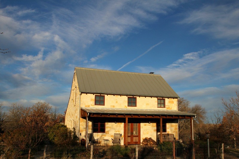 Example of a farmhouse exterior home design in Dallas