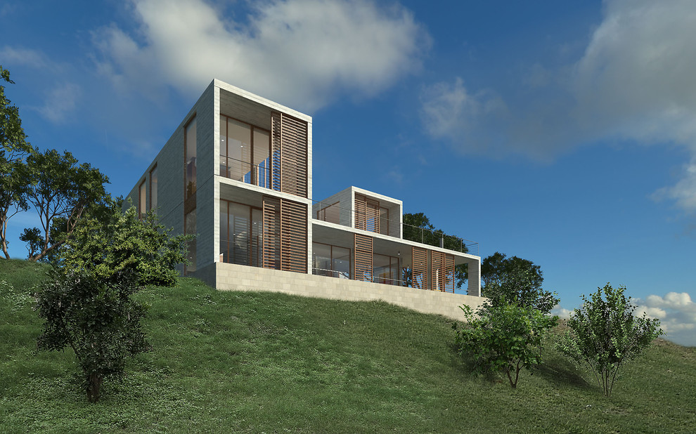 Kleines, Zweistöckiges Modernes Einfamilienhaus mit Betonfassade, beiger Fassadenfarbe und Flachdach