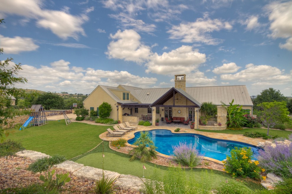 Example of an island style exterior home design in Austin