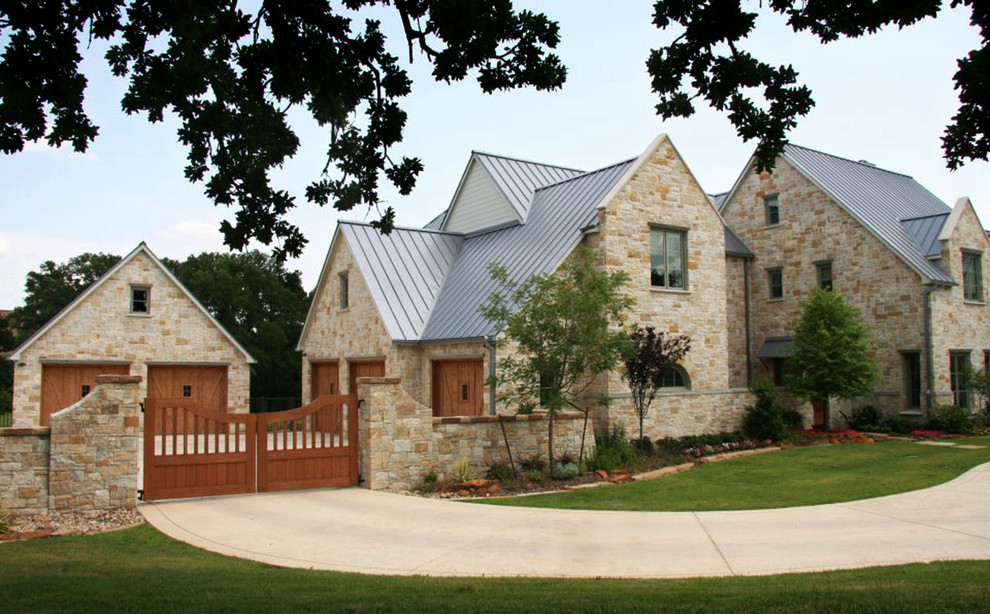 Inspiration for a large classic two floor house exterior in Dallas with stone cladding.