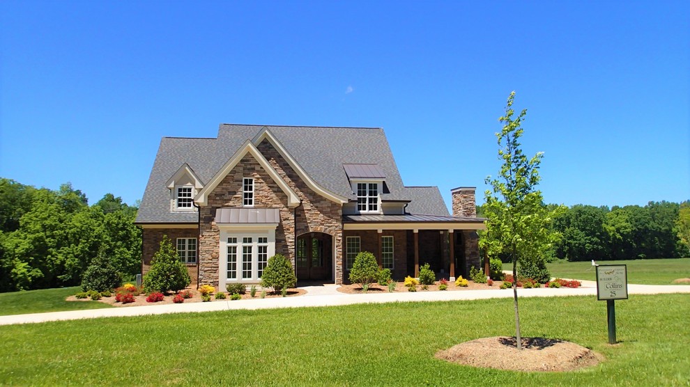 Inspiration for a large and multi-coloured country two floor detached house in Raleigh with mixed cladding and a mixed material roof.