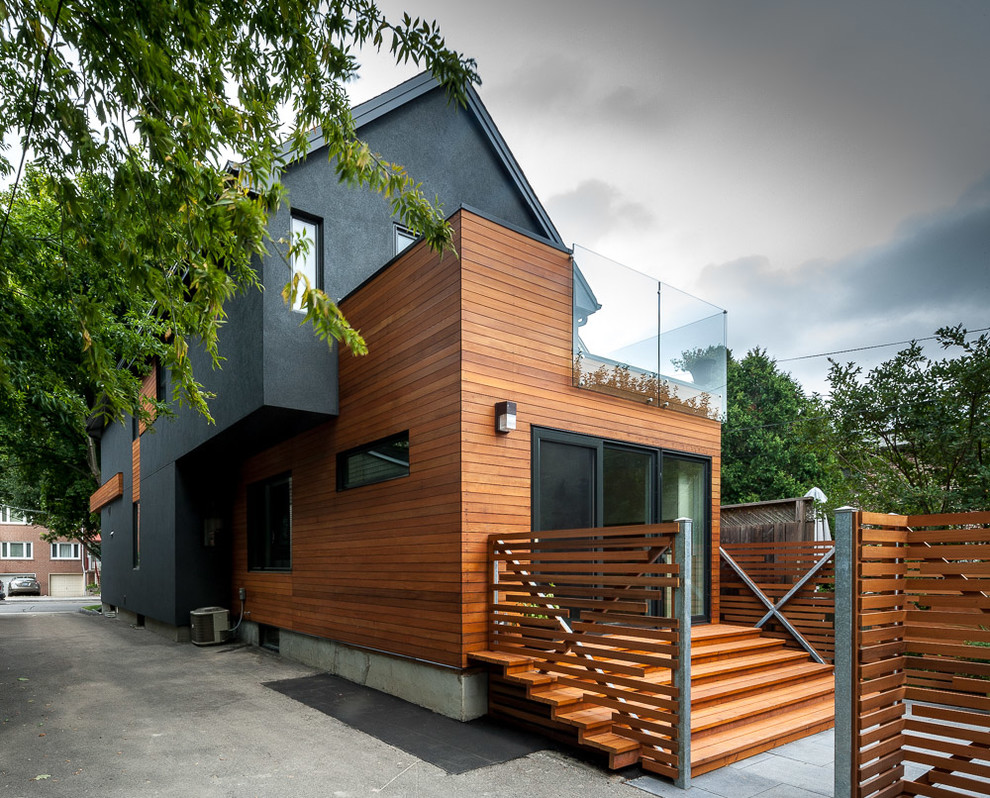 Inspiration for a mid-sized contemporary brown three-story mixed siding gable roof remodel in Toronto