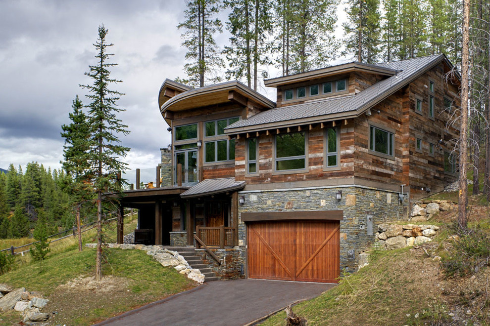 Example of a mountain style two-story wood exterior home design in Vancouver