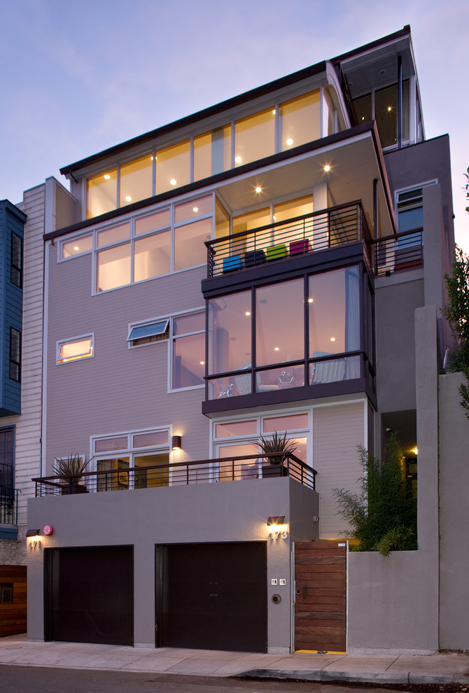 Mid-sized trendy beige three-story wood flat roof photo in San Francisco