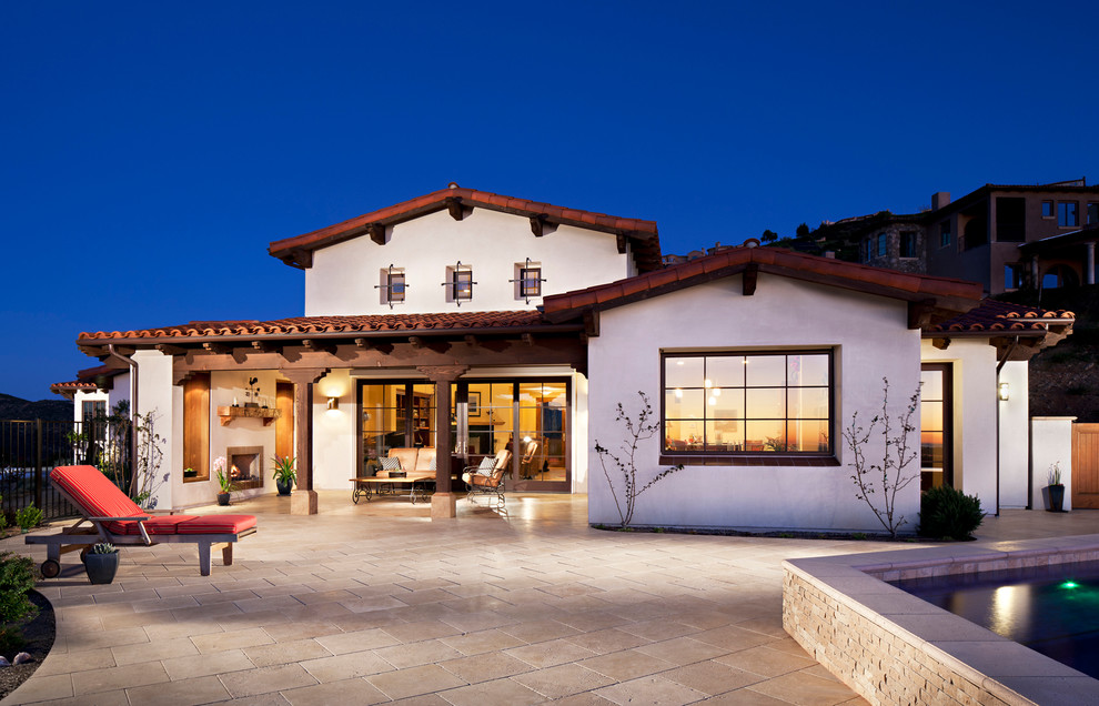 Design ideas for a large and white classic two floor clay house exterior in San Diego with a tiled roof.