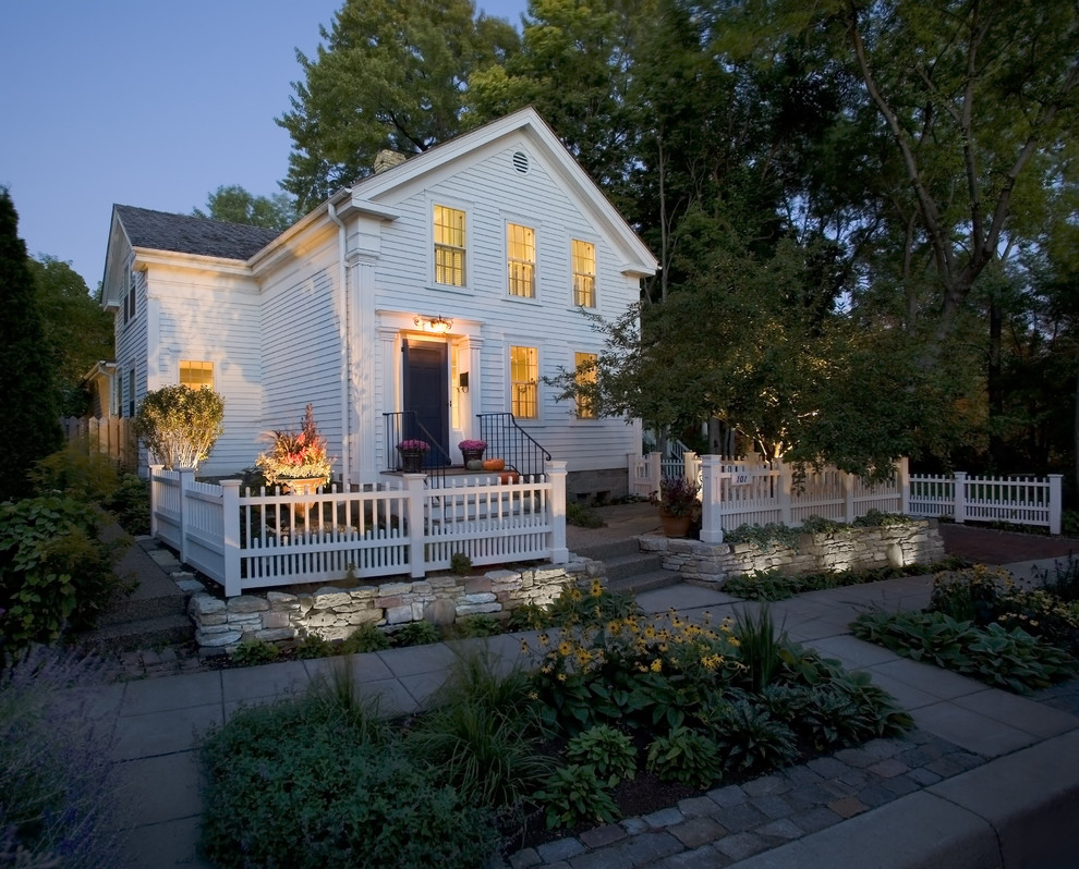 Small traditional white two-story wood exterior home idea in Minneapolis