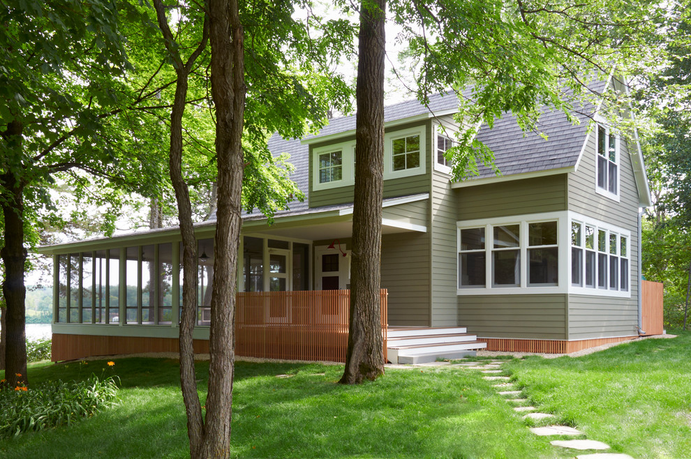 Inspiration for a mid-sized timeless green two-story mixed siding gable roof remodel in Minneapolis