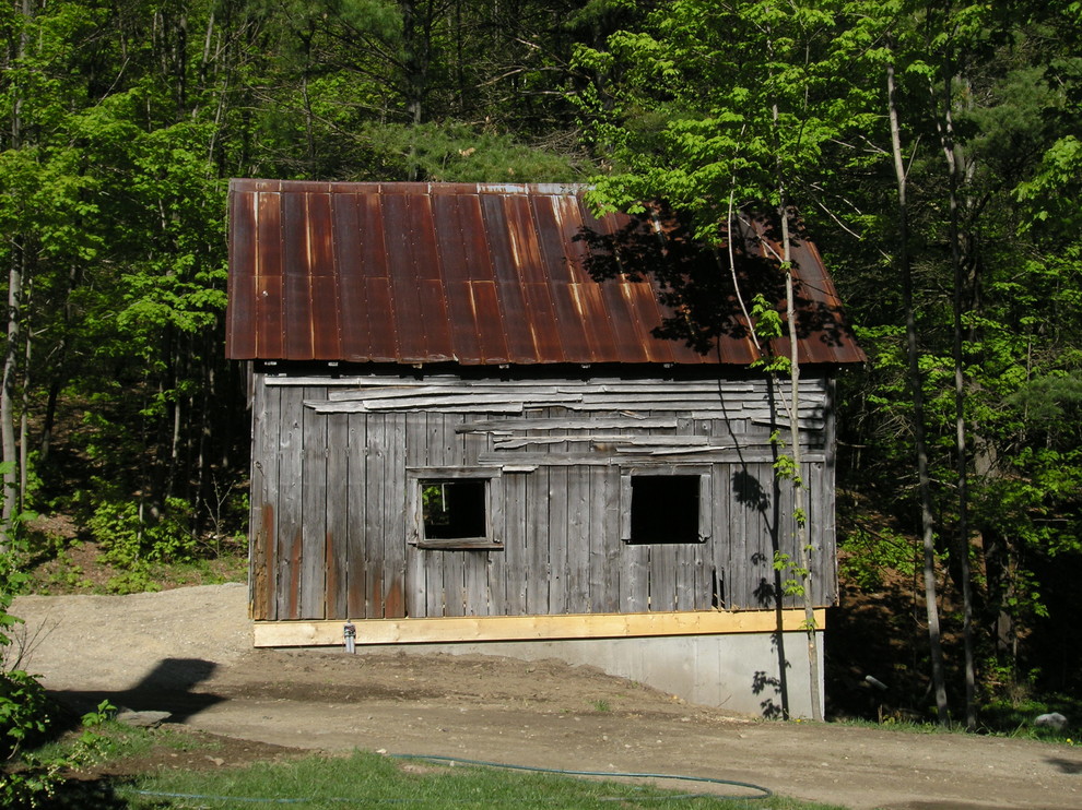 Example of a country exterior home design in Burlington