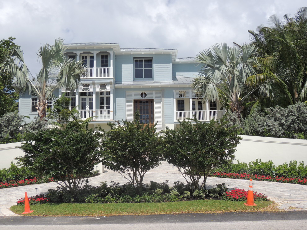 This is an example of an expansive and blue world-inspired two floor render house exterior in Miami.