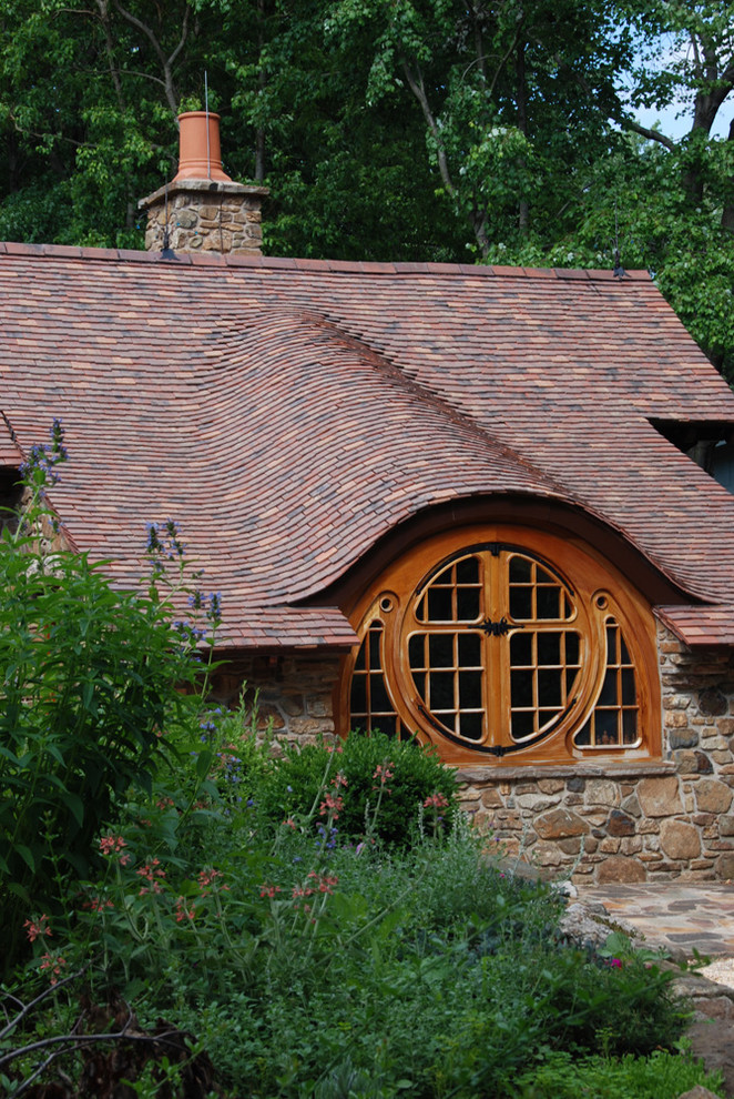 Rustic stone exterior home idea in Philadelphia