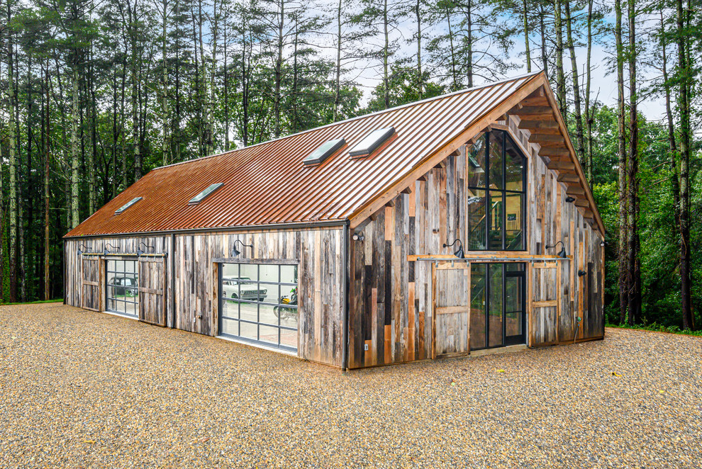 Example of a huge mountain style multicolored two-story wood gable roof design in Other with a metal roof