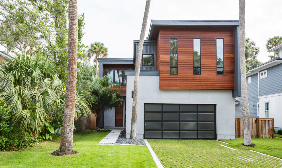 Inspiration for a contemporary two floor detached house in Jacksonville with mixed cladding.
