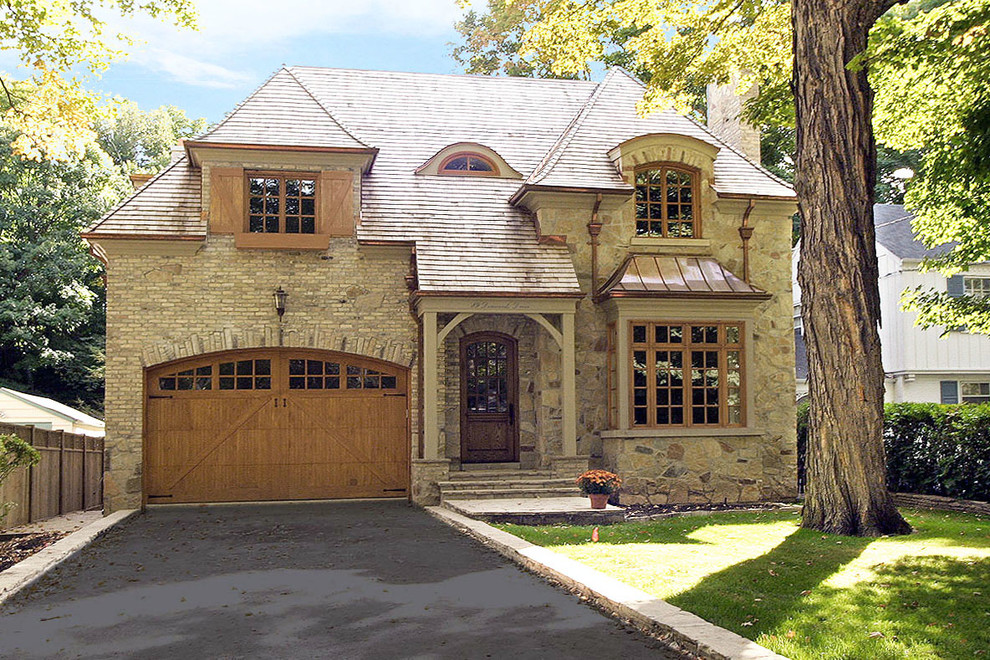 Design ideas for a large and beige two floor brick detached house in Toronto with a hip roof and a shingle roof.