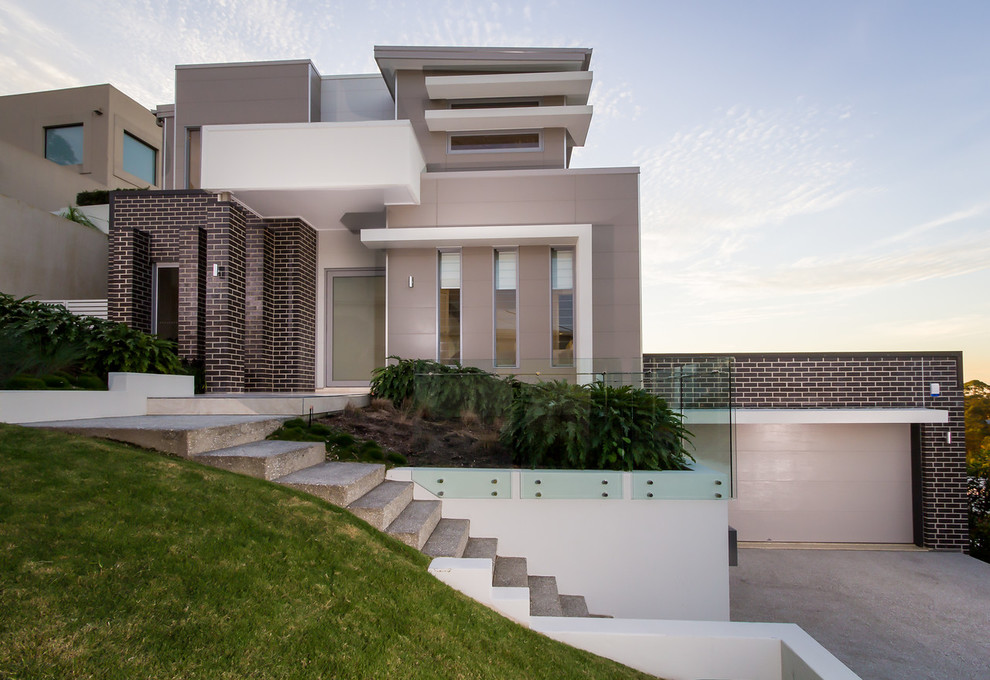 Modernes Haus mit grauer Fassadenfarbe und Flachdach in Brisbane