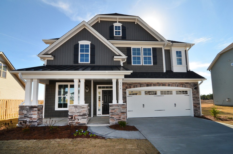 Large elegant gray two-story mixed siding exterior home photo in Raleigh