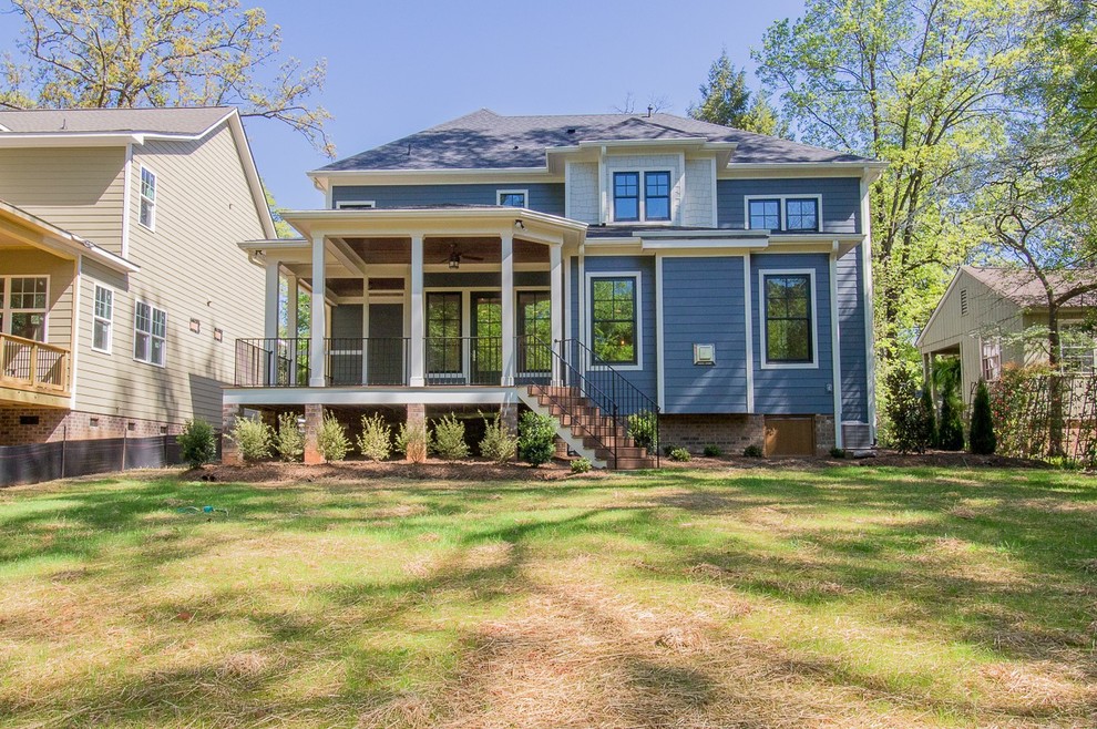 This is an example of a blue two floor house exterior in Atlanta with mixed cladding and a hip roof.