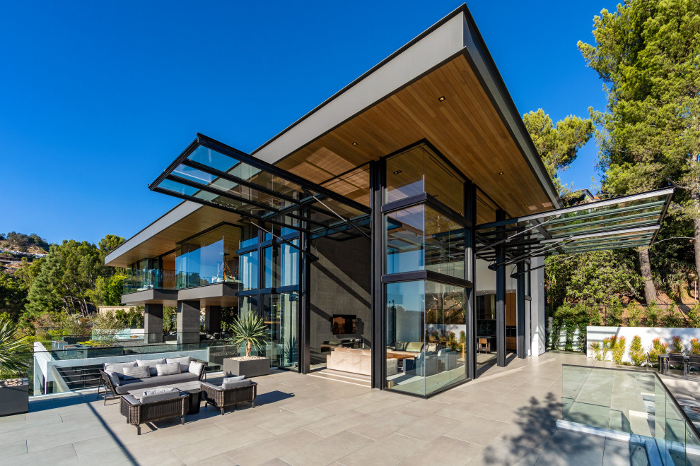 Design ideas for a contemporary glass detached house in Orange County with a lean-to roof.