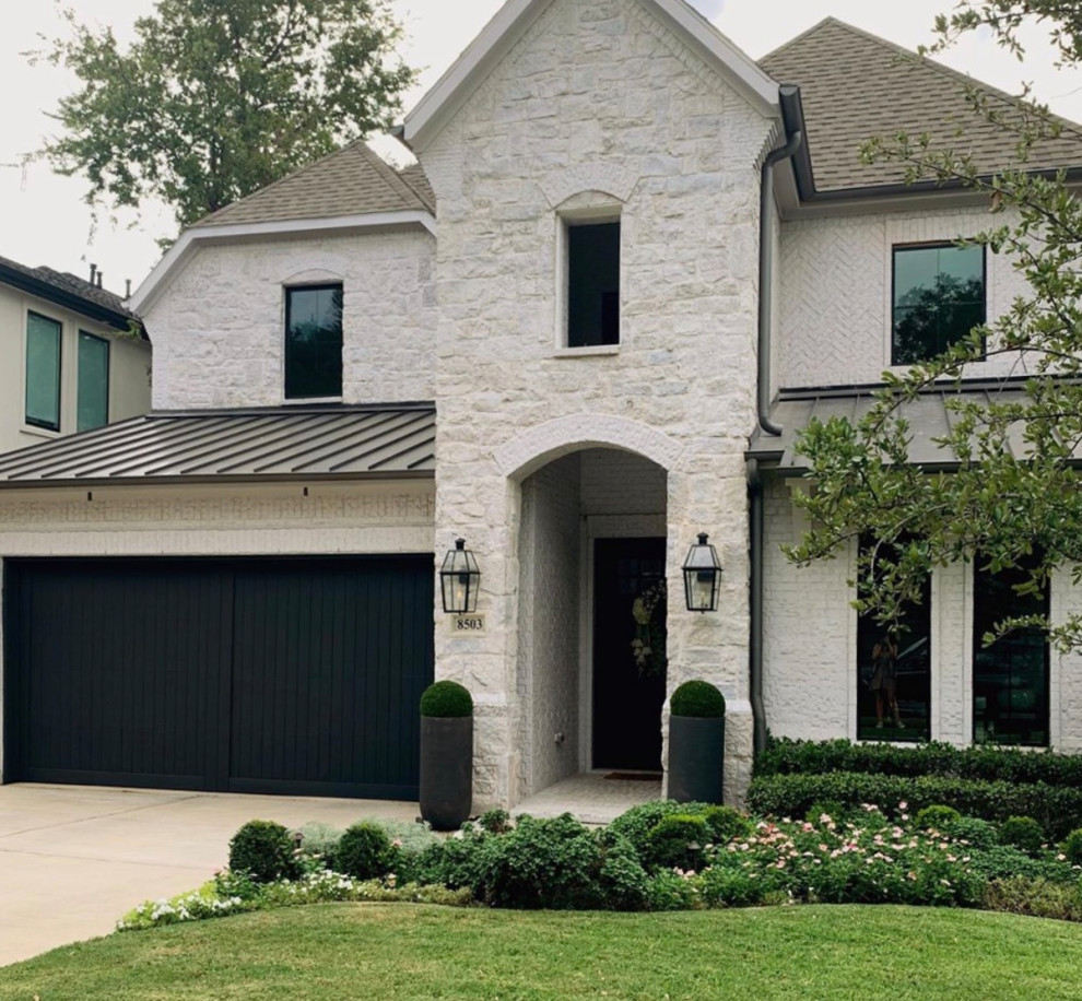 Photo of a white classic two floor house exterior in Dallas with stone cladding.