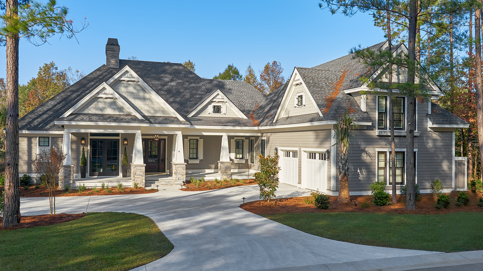 Inspiration for a large transitional gray two-story concrete fiberboard exterior home remodel in Atlanta with a hip roof