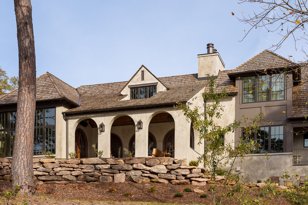 Inspiration for a large coastal gray three-story stucco exterior home remodel in Other