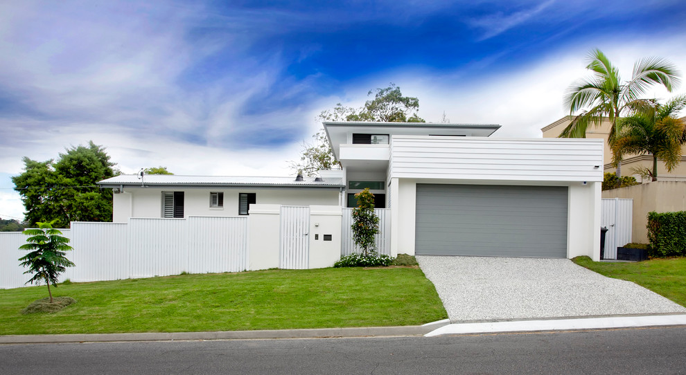 Photo of a white contemporary two floor house exterior in Sunshine Coast.