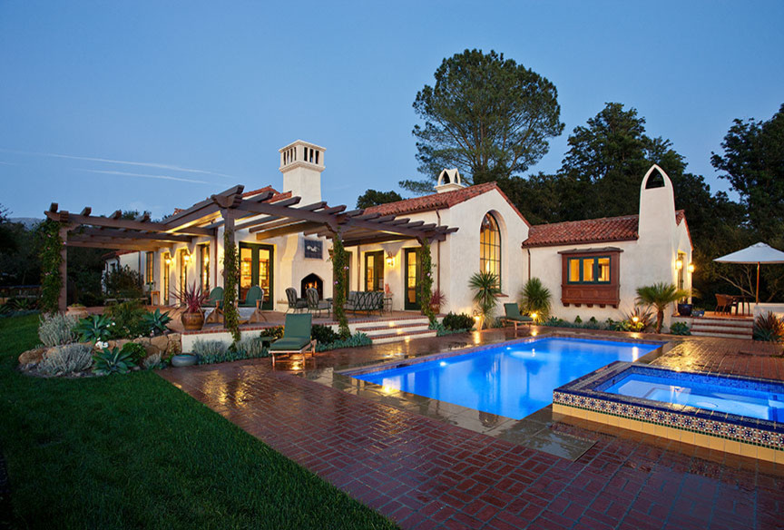 Inspiration for a large mediterranean white two-story stucco exterior home remodel in Santa Barbara