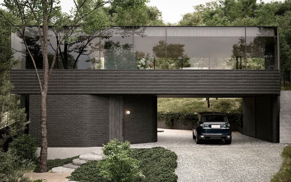 Imagen de fachada de casa negra actual de tamaño medio de dos plantas con revestimiento de ladrillo y tejado plano
