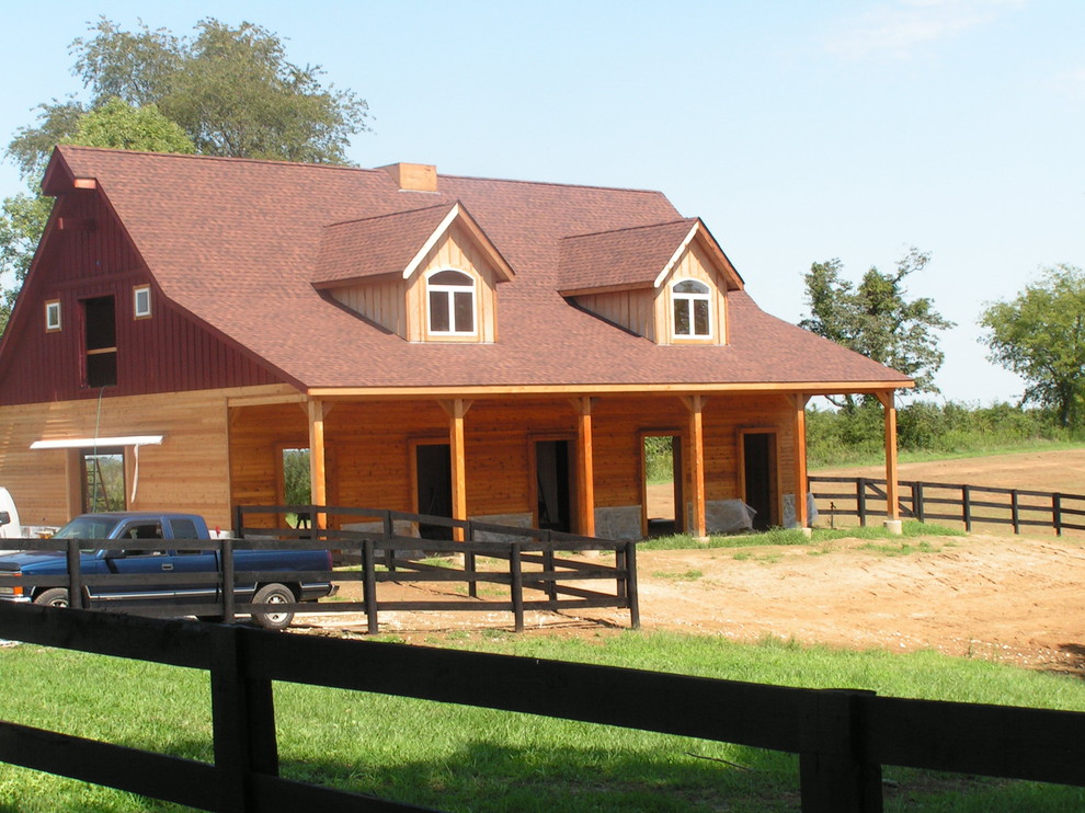 Horse barn still under construction Traditional House Exterior