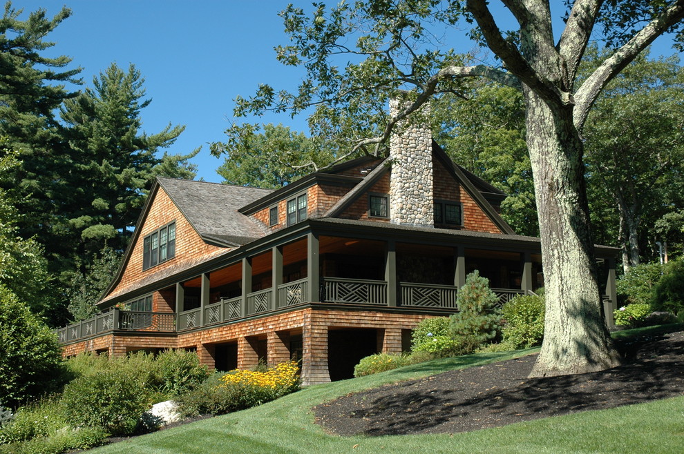 Example of a large mountain style brown two-story wood exterior home design in Boston with a shingle roof