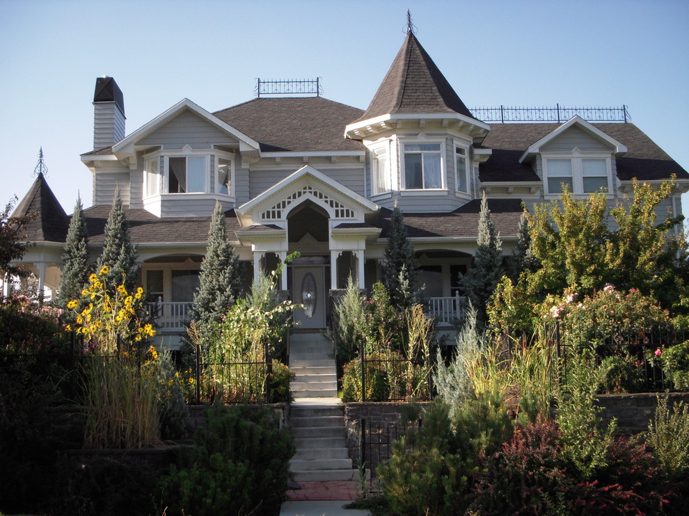 Ornate wood exterior home photo in Salt Lake City