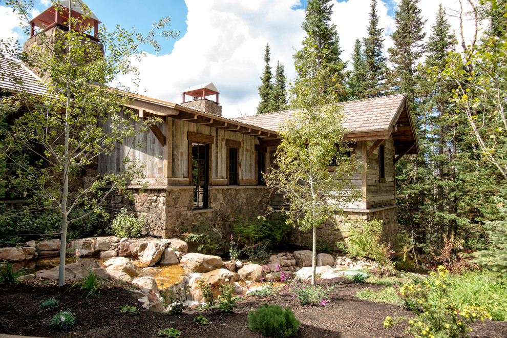 Design ideas for a rustic house exterior in Salt Lake City with wood cladding.