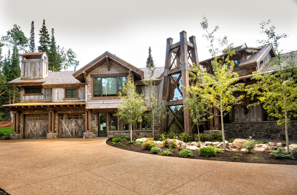 Example of a mountain style wood exterior home design in Salt Lake City