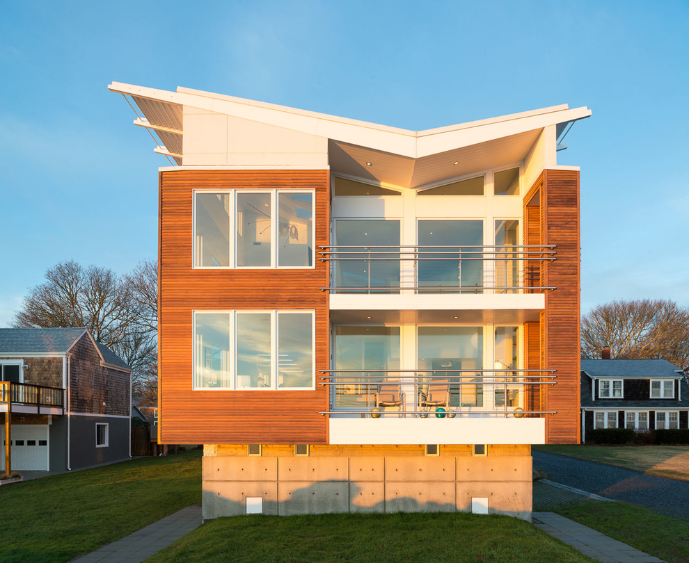 Example of a trendy two-story wood exterior home design in New York