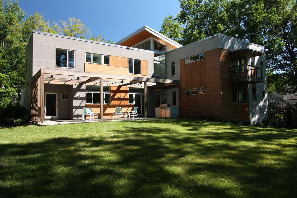 Ispirazione per la villa contemporanea a due piani di medie dimensioni con rivestimento in legno e tetto piano