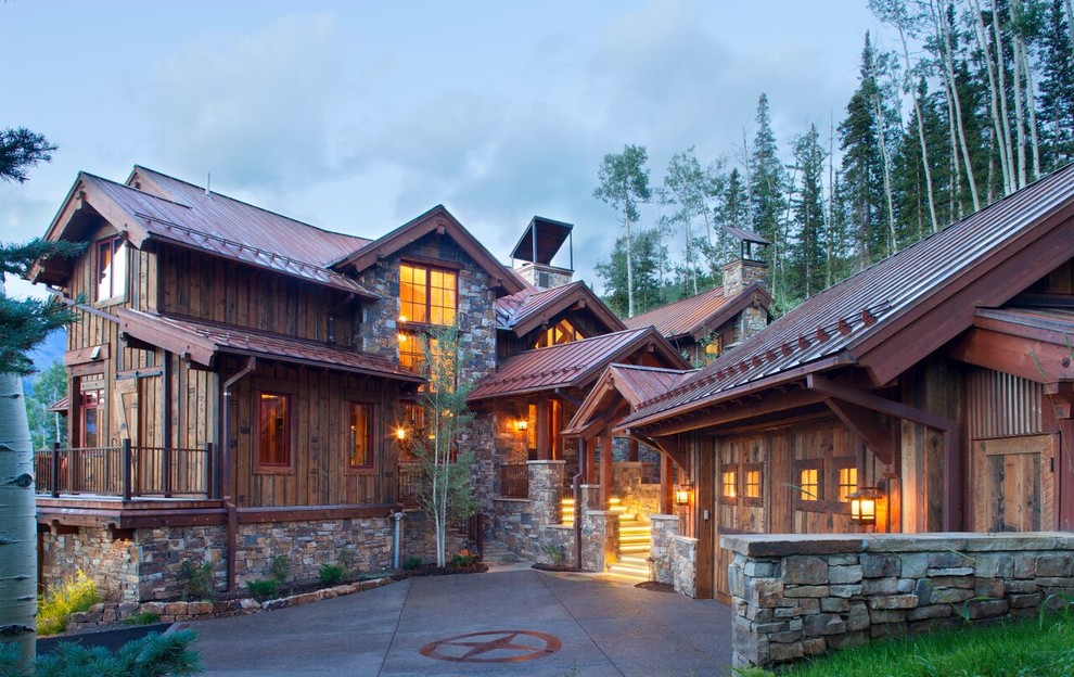 Mid-sized mountain style brown three-story wood gable roof photo in Denver