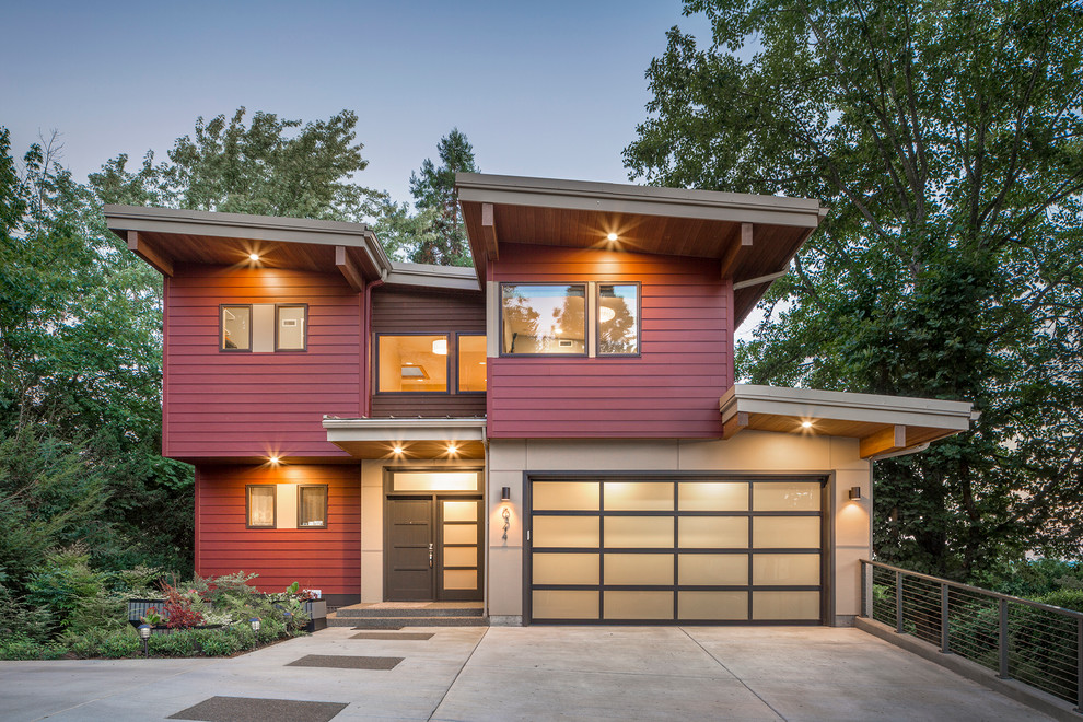 Идея дизайна: двухэтажный, красный дом в современном стиле с односкатной крышей