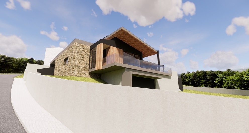 На фото: частный загородный дом среднего размера в современном стиле с облицовкой из бетона