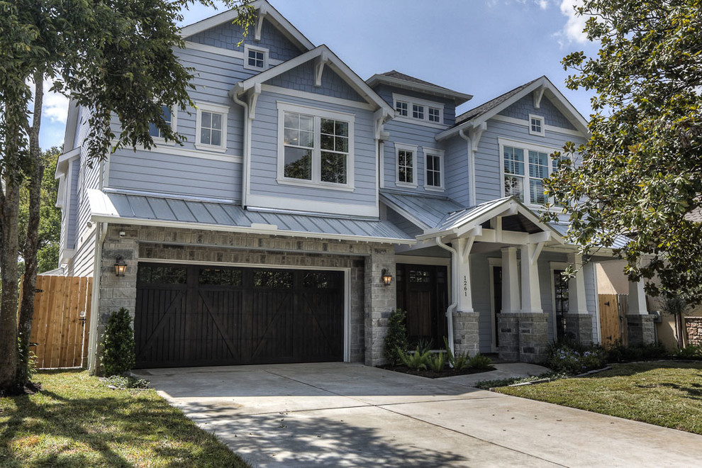 Inspiration for a large craftsman blue two-story mixed siding gable roof remodel in Houston